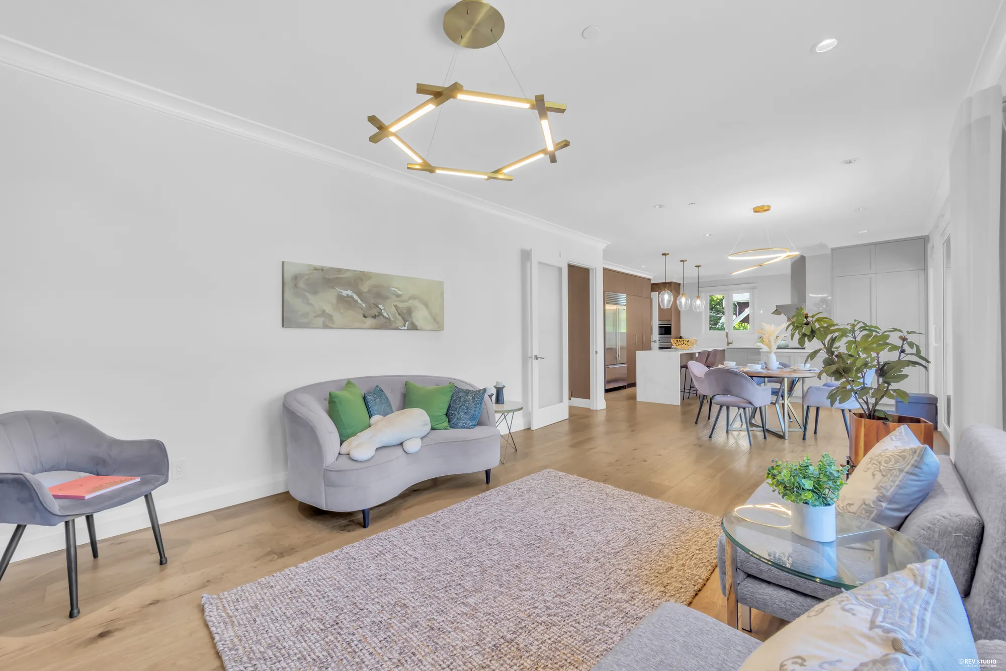 The family room from the fireplace end, the breakfast area visible beyond