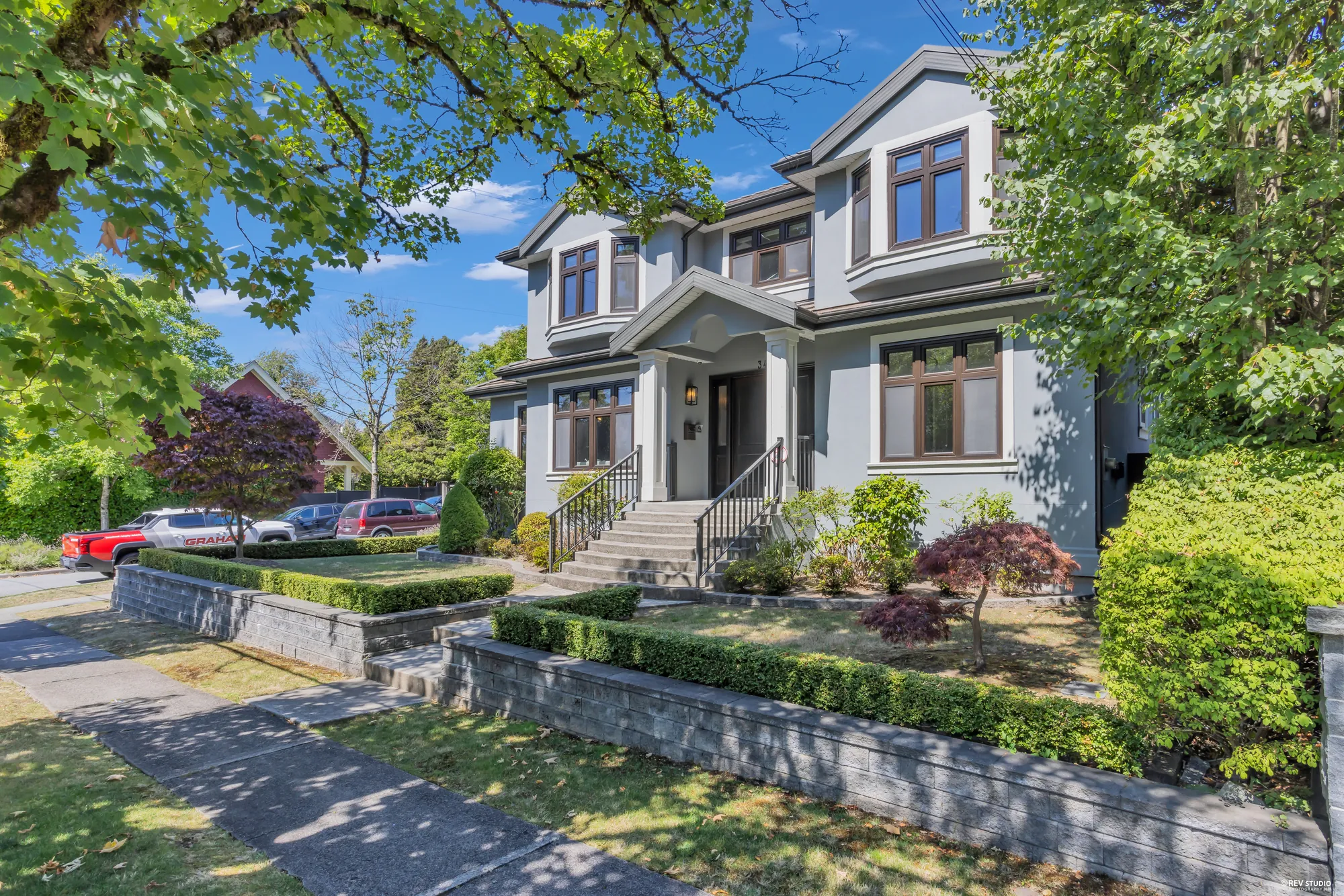 3491 West 40th Avenue from the east, showing the corner and the terraced front garden